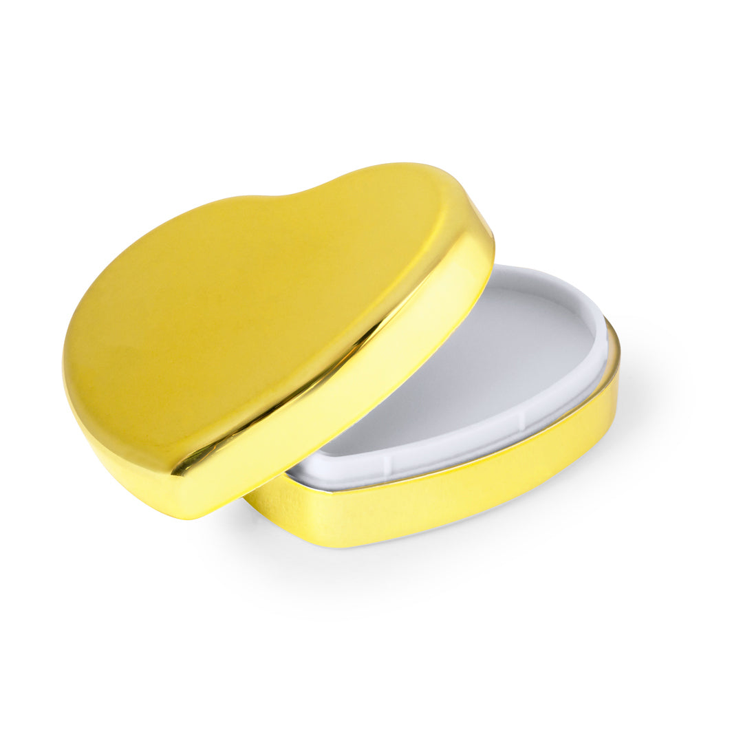 Bálsamo labial em formato de coração dourado rosa com gravação “Vtote”, acabamento metálico brilhante e tampa de pressão, fotografado em fundo neutro de estúdio.